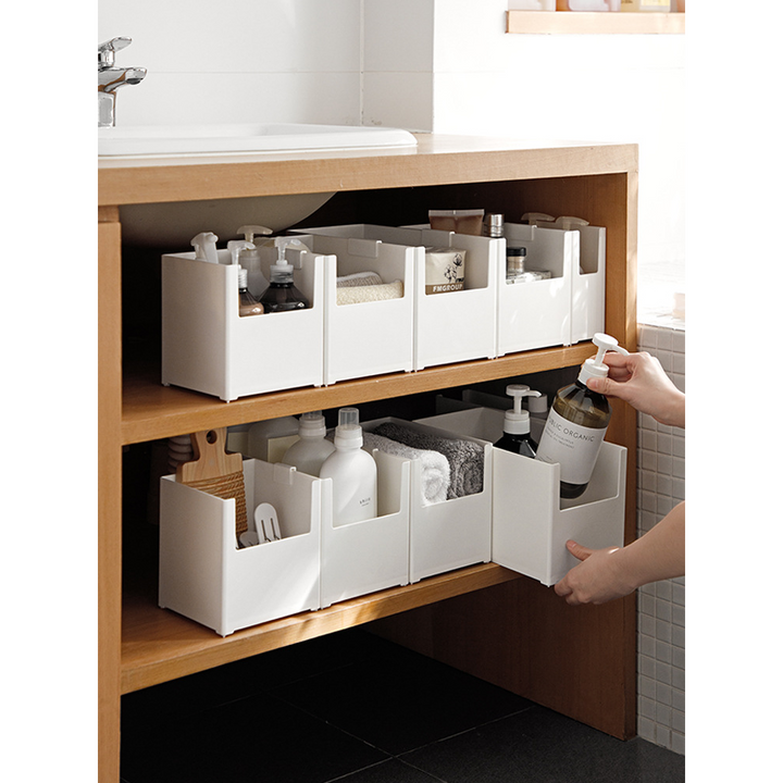 Oppbevaringsbokser for organisering i skap