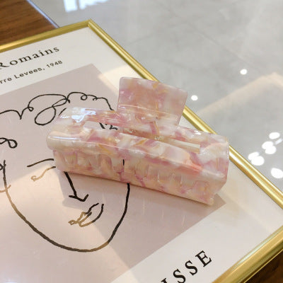 Moderne hårklyper i marmordesign